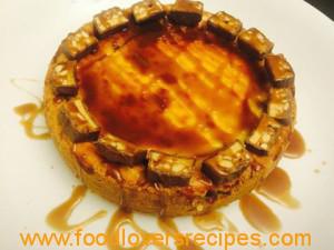 Snickers cheesecake with caramel sauce